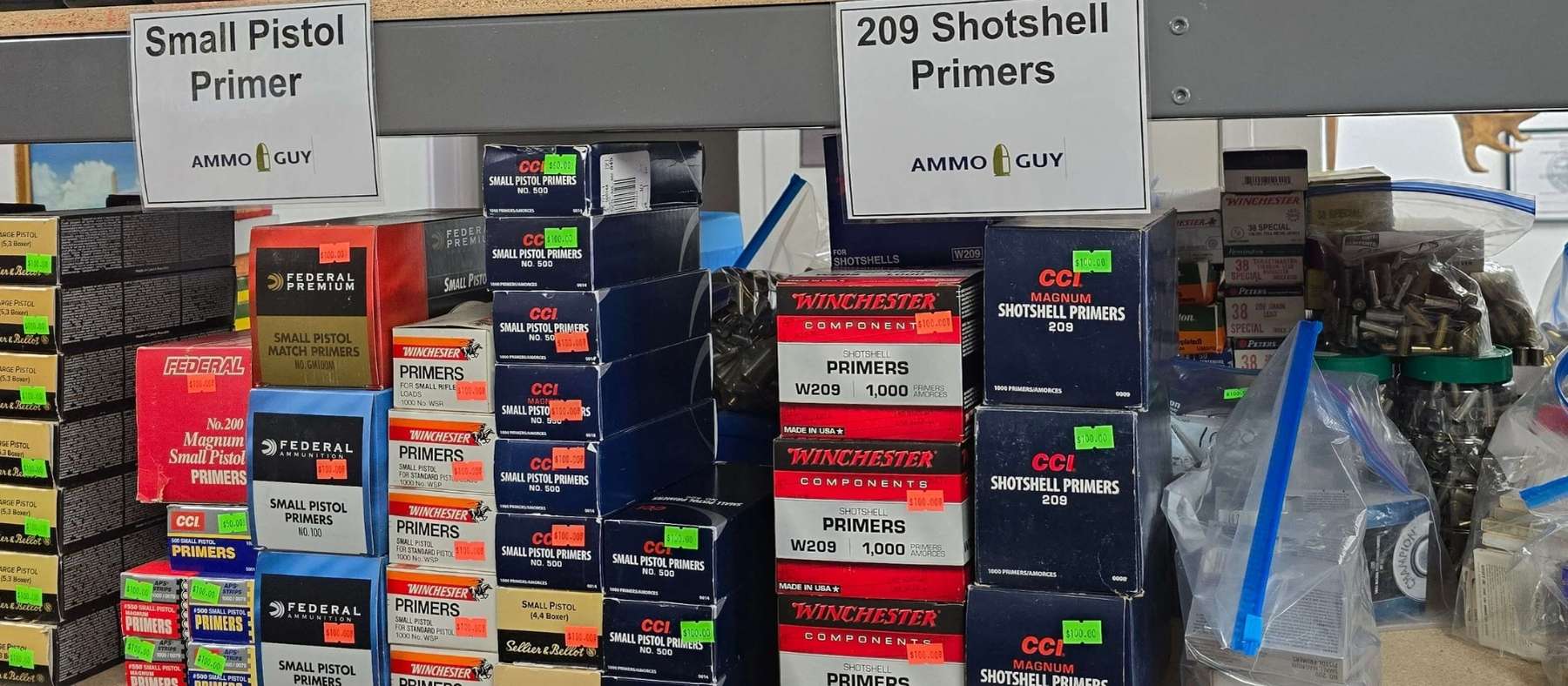 Small pistol primers and varopis 209 shotshell primers are featured on a shelf at Ammo Guy in Santa Ana.